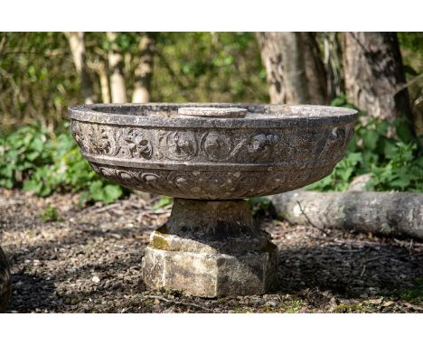 A CARVED MARBLE FOUNTAIN BOWL 19TH CENTURY On an associated carved stone socle 55cm high overall, the bowl 87cm diameter  Con