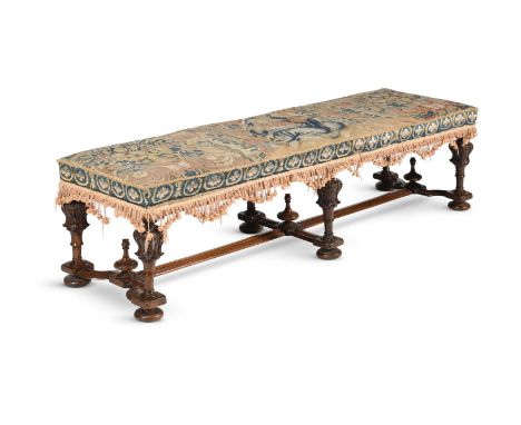 A WALNUT AND TAPESTRY LONG STOOL OR WINDOW SEAT 19TH CENTURY, THE TAPESTRY 17TH OR 18TH CENTURY 42cm high, 152cm wide, 46cm d