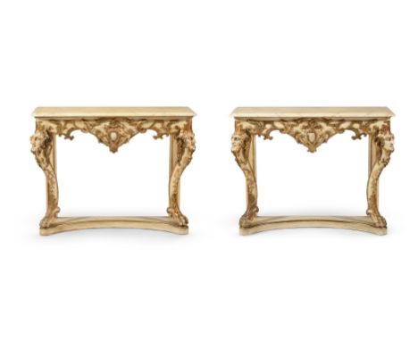 A PAIR OF ITALIAN CREAM PAINTED AND PARCEL GILT CONSOLE TABLES LATE 19TH CENTURY Both with simulated marble tops each 86cm hi