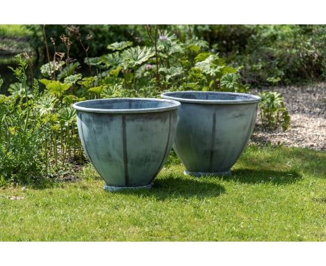 A LARGE PAIR OF VERDIGRIS COPPER PLANTERS OF RECENT MANUFACTURE Each with rollover edge, tapering cylindrical body, pierced f