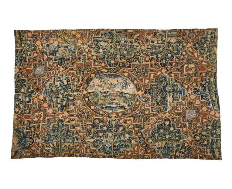 A RARE HERALDIC TABLE CARPET  PROBABLY SPANISH NETHERLANDS, 17TH CENTURY  Woven with central oval cartouche of a scrolling tw