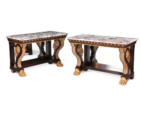 A PAIR OF SIMULATED ROSEWOOD AND PARCEL GILT CONSOLE TABLES IN REGENCY STYLE, EARLY 20TH CENTURY Each with a marble top above