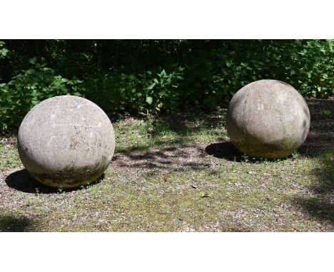 A LARGE PAIR OF STONE COMPOSITION BALLS 20TH CENTURY each approximately 70cm diameter  Condition Report:  With weathering - c