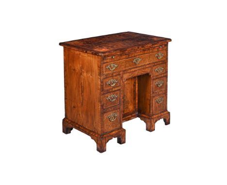 A GEORGE II WALNUT KNEEHOLE DESK  CIRCA 1740 83cm high, 82cm wide, 54cm deepProvenance: Formerly from Brocket Hall, Hertfords
