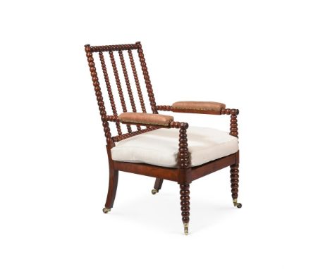 A WILLIAM IV MAHOGANY BOBBIN TURNED OPEN ARMCHAIR IN THE MANNER OF GILLOWS, CIRCA 1830 With leather upholstered arms and two 