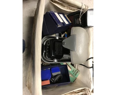 Two boxes containing various camera accessories, cases, etc