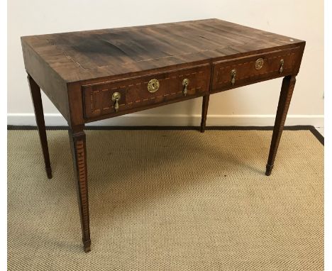 A circa 1800 Italian walnut and inlaid writing table, the top with parquetry banded decoration over two similarly decorated f