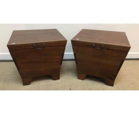 A pair of modern Indonesian teak wine coolers of square tapered form with brass swan neck handles, raised on bracket feet, 50