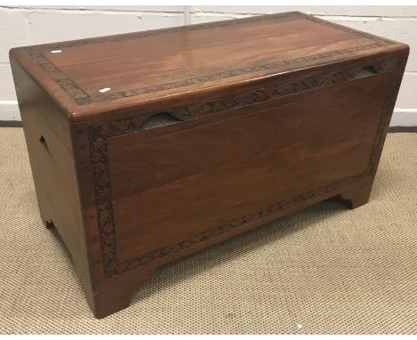 An Eastern carved camphor wood trunk, 100 cm wide x 49 cm deep x  56 cm high