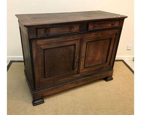 A 19th Century Italian oak side cabinet with plain top and moulded edge over two slim drawers with central locking system and