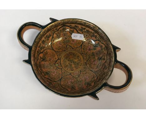 A Zsolnay Pecs two-handled dish, polychrome decorated with gilt highlighting and decorated with panels of birds and flowers, 