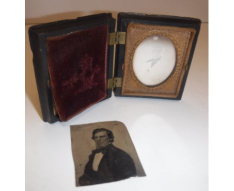 A Victorian daguerrotype portrait of "Young gentleman in white tie", housed in a scrolling foliate decorated moulded case / f