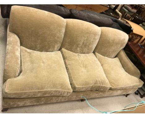 A Kingcome sofa in the Howard style, upholstered in Colefax &amp; Fowler "Theo Sand Otto Velvets" upholstery, raised on squar