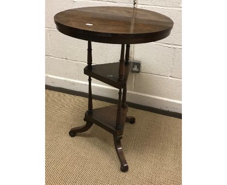 A Victorian rosewood occasional table, the circular top on a tripod twin platform base to splayed  legs and scroll feet, 51 c