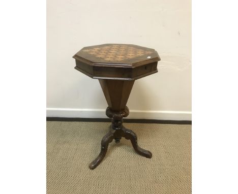 A Victorian walnut and parquetry games top trumpet-shaped work table, the rising top opening to reveal a fitted paper-lined i