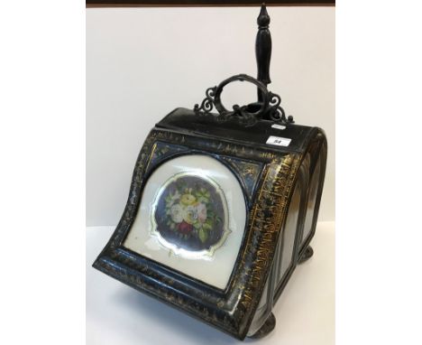 A Victorian gilt and black painted tole ware type coal scuttle with shovel, the rising cover with arch panel and hand waterco