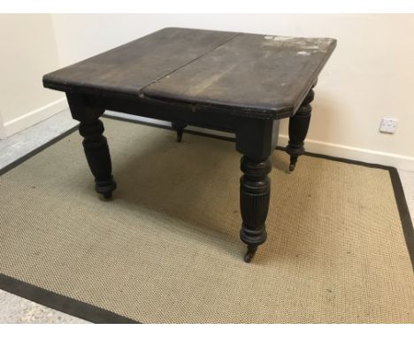 A Victorian oak extending dining table of square form, 104 cm x 104 cm x 75 cm high, an early to mid 20th Century oak bureau 