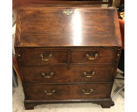 A 19th Century ash bureau, the plain top over a sloping fall enclosing a basic fitted interior, over two short and two long d