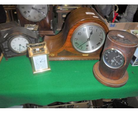 A mahogany and inlaid cased mantel clock with silvered dial and Arabic numerals, a small oak cased mantel clock, brass cased 
