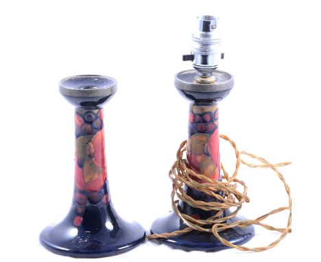 Pair of William Moorcroft Pomegranate candlesticks, probably for Liberty, Tudric pewter mounts, one with wired fitting as a l