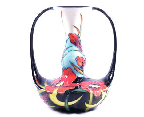 Nicola Slaney for Moocroft, a twin handled vase in the Satin Flower design, ©2000, vivid red flowers on a dark blue ground wi