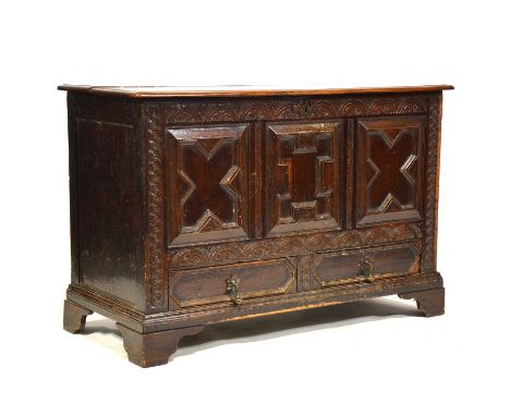 Joined oak mule chest, hined lid, recessed geometric mouldings, two drawers under, bracket feet, width 118cm, depth 55cm, hei