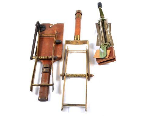 Three vintage fly fishing line dryers including a handheld Farlow &amp; Co "Wilson-Wetherall” model, a Farlow desk clamp "Sex