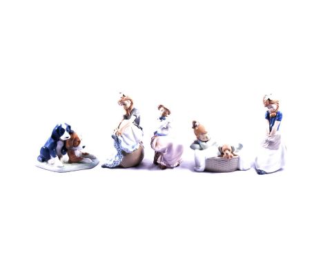 Eight assorted Nao figurines, and a Lladro figure, mostly girls with pets or puppy groups.Condition report:All items are in v