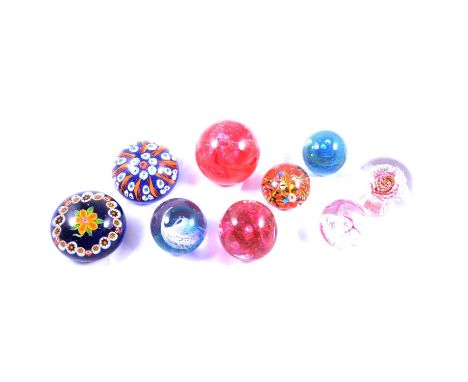 Small collection of glass paperweights, including a French style floral weight, diameter 8cm, Caithness and others.Qty: 10