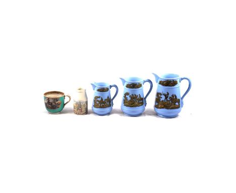 Collection of Prattware pottery, inculding a graduating set of three blue ground jugs, largest 19cm, soap dishes, moustache c