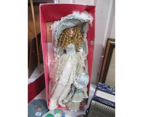 A tall porcelain doll in vintage dress