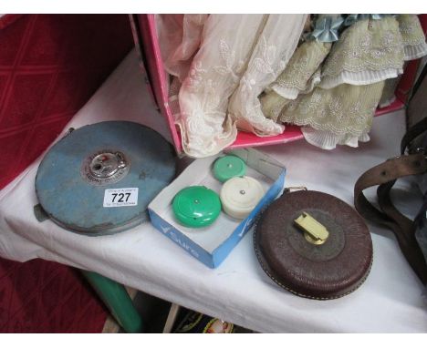 Two large vintage measuring tapes and 3 smaller examples