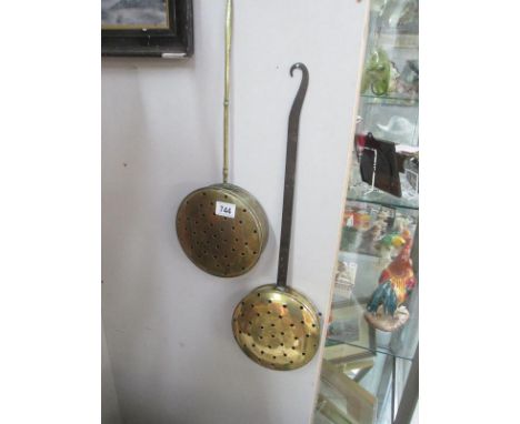 A pair of vintage brass chestnut roasters