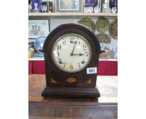 A wooden mantel clock