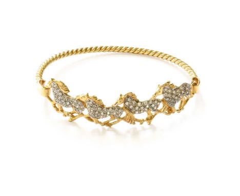 A 9 Carat Gold Hinged Horse Paste Bangle, inner measurements 6.3cm by 4.9cmGross weight 18.3 grams.