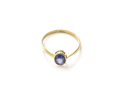 A Sapphire Ring, stamped '18CT', finger size VThe ring is in good condition. It is stamped '18CT' and an illegible maker/spon
