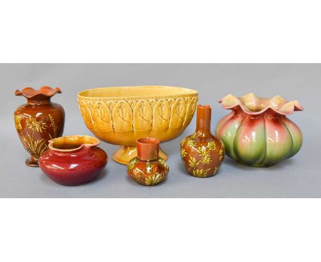 Linthorpe Pottery; a footed bowl, moulded with lobster claws, model No.1764, three leaf moulded vases and two others (one tra