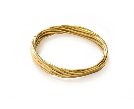 A Hinged Bangle, stamped '9K', inner measurements 6.2cm by 5.5cm (a.f.)Gross weight 24.6 grams.