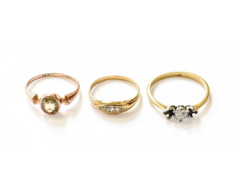 An 18 Carat Diamond Five Stone Ring, finger size M; A 9 Carat Gold Citrine Ring, finger size N (a.f.); and A Three Stone Ring