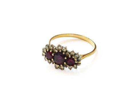 An 18 Carat Gold Synthetic Ruby and Diamond Triple Cluster Ring, the oval cut synthetic ruby flanked by round cut rubies with