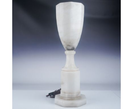 A Regency-style alabaster table lamp showcasing a tapered form and elegant octagonal base. The lamp measures 24.75"H and high