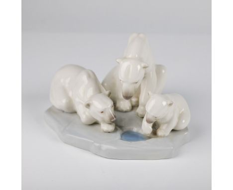 A charming Lladro porcelain figurine titled Bearly Love, No. 1001443, featuring a polar bear family with a mother and two cub