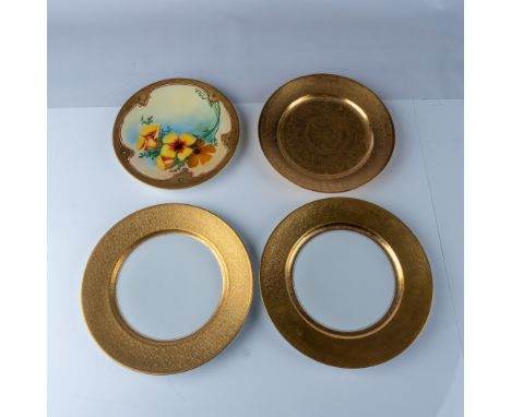 A mixed lot of decorative plates featuring various makers and styles. Includes two gold-encrusted plates by Pickard, Rosentha