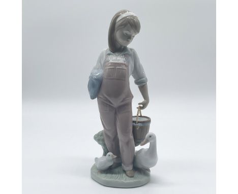 Charming Lladro porcelain figurine titled "Saturday's Child," item number 01006022, sculpted by Juan Huerta. Issued in 1993 a