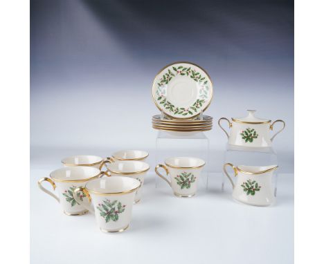 Elegant Lenox Holiday tea set featuring the classic holly and berry motif with gold trim. This 14-piece set includes six teac