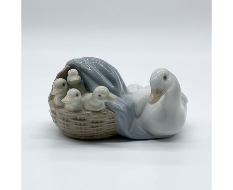 Lladro porcelain figurine "Mother Goose with Ducklings," sculpted by Juan Huerta. This charming piece features a mother goose