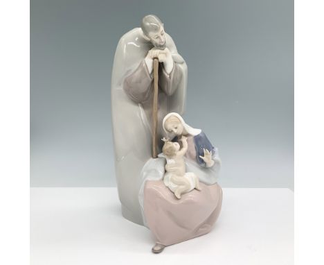 Lladro porcelain figurine titled Blessed Family, model number 1001499. This piece depicts Joseph and Mary tenderly gazing at 