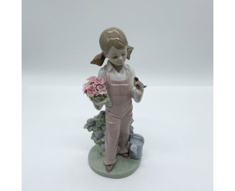 This exquisite Lladro porcelain figurine, titled "Spring," item number 01005217, was sculpted by Juan Huerta. Known as "Prima