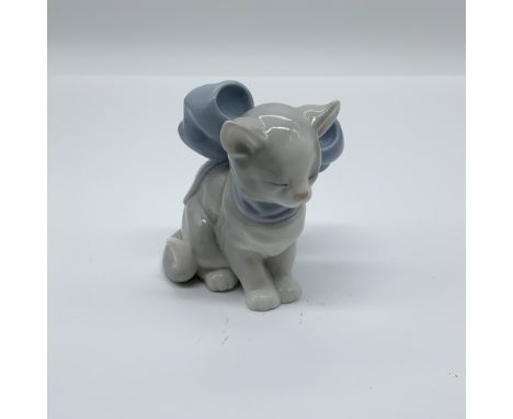 Charming Nao by Lladro porcelain figurine titled "Kitty Present," model number 1348. This delightful piece features a seated 