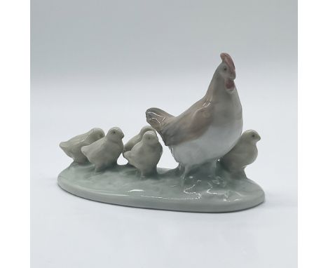 This charming Nao by Lladro porcelain figurine, titled "Hen with Chicks," depicts a mother hen leading her brood of five chic